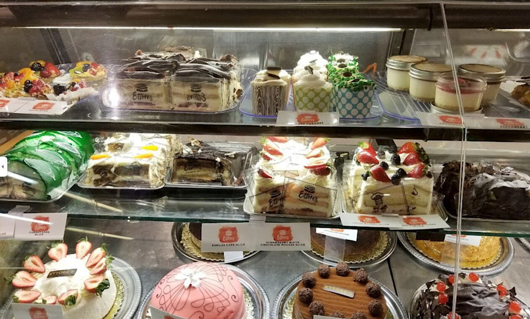 Bakery display case of vanilla-forward cakes and pastries illustrating creative uses for vanilla in sweet cookingCreative Uses for Savory Vanilla