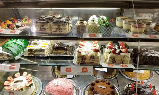 Bakery display case of vanilla-forward cakes and pastries illustrating creative uses for vanilla in sweet cookingCreative Uses for Savory Vanilla